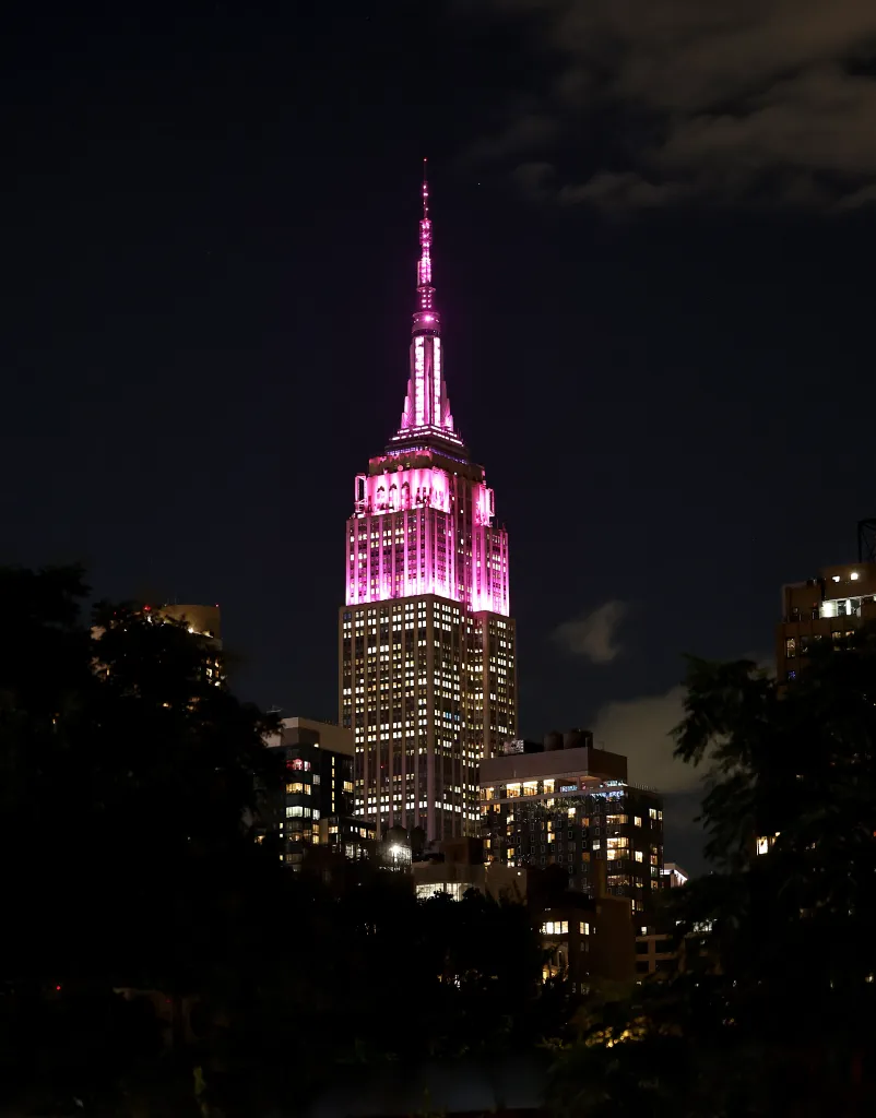 The Empire State Building sparkling in pink in honor of Dolly Parton's life and legacy.