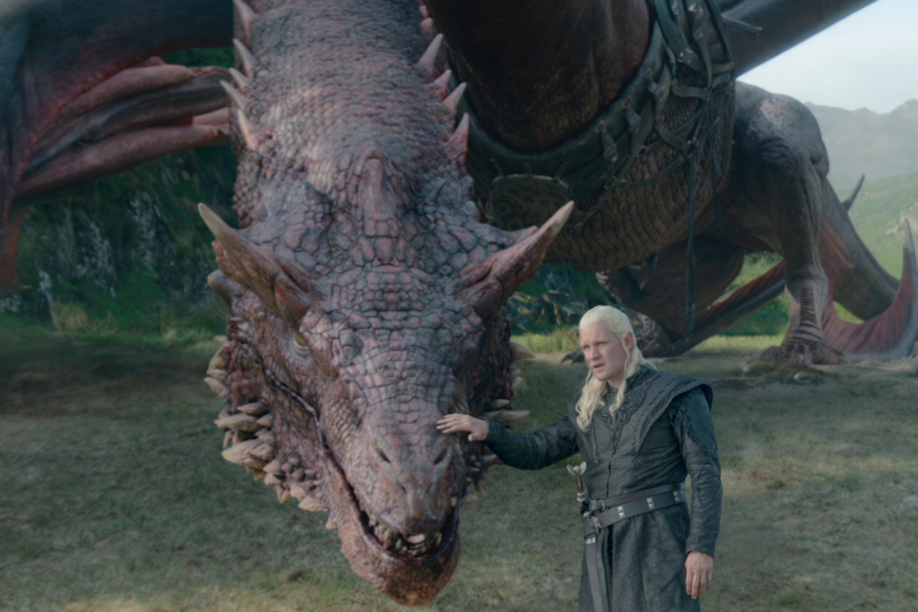 Matt Smith as Daemon Targaryen petting his dragon, Caraxes.