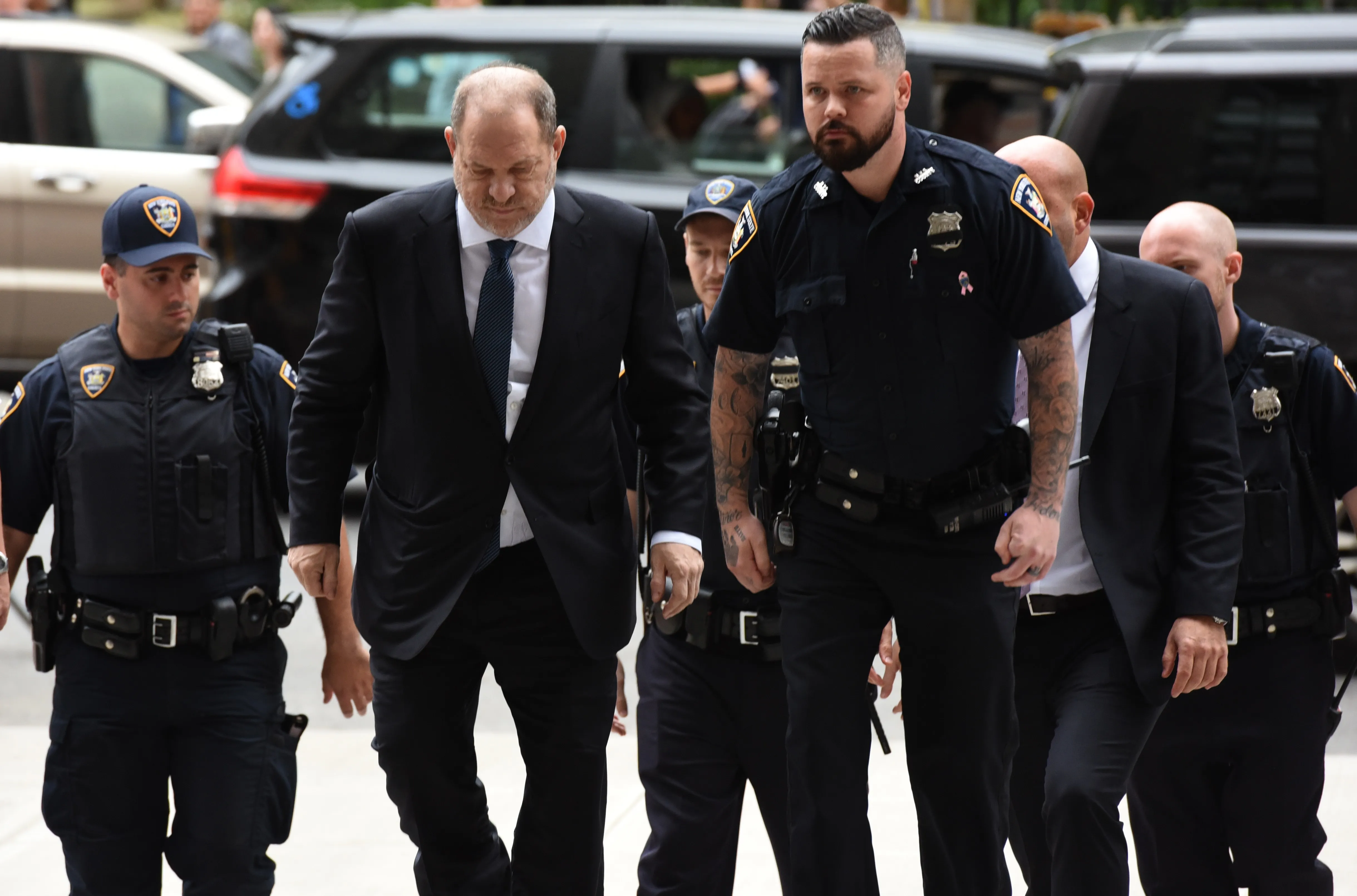 Harvey Weinstein escorted by court officers into New York Criminal Court.