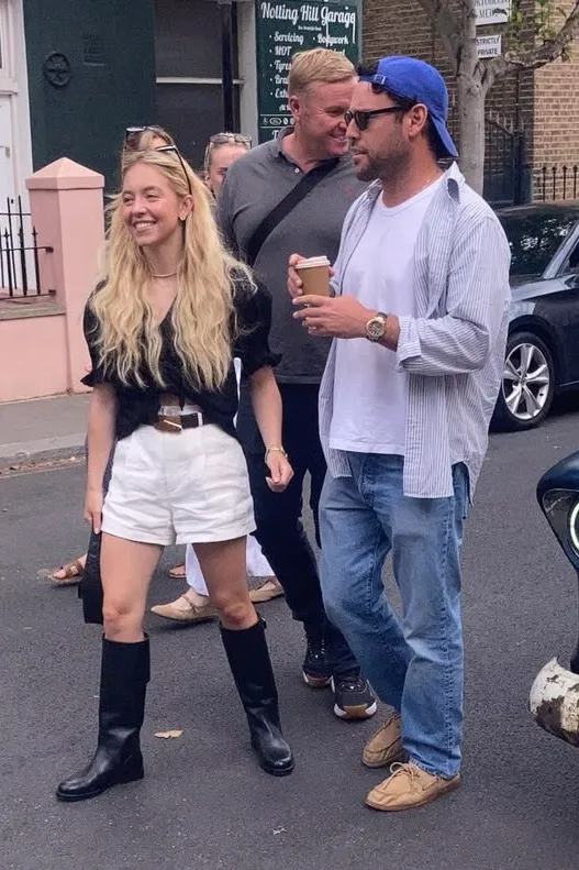 Sydney Sweeney and Scooter Braun share laughs during a walk in London.
