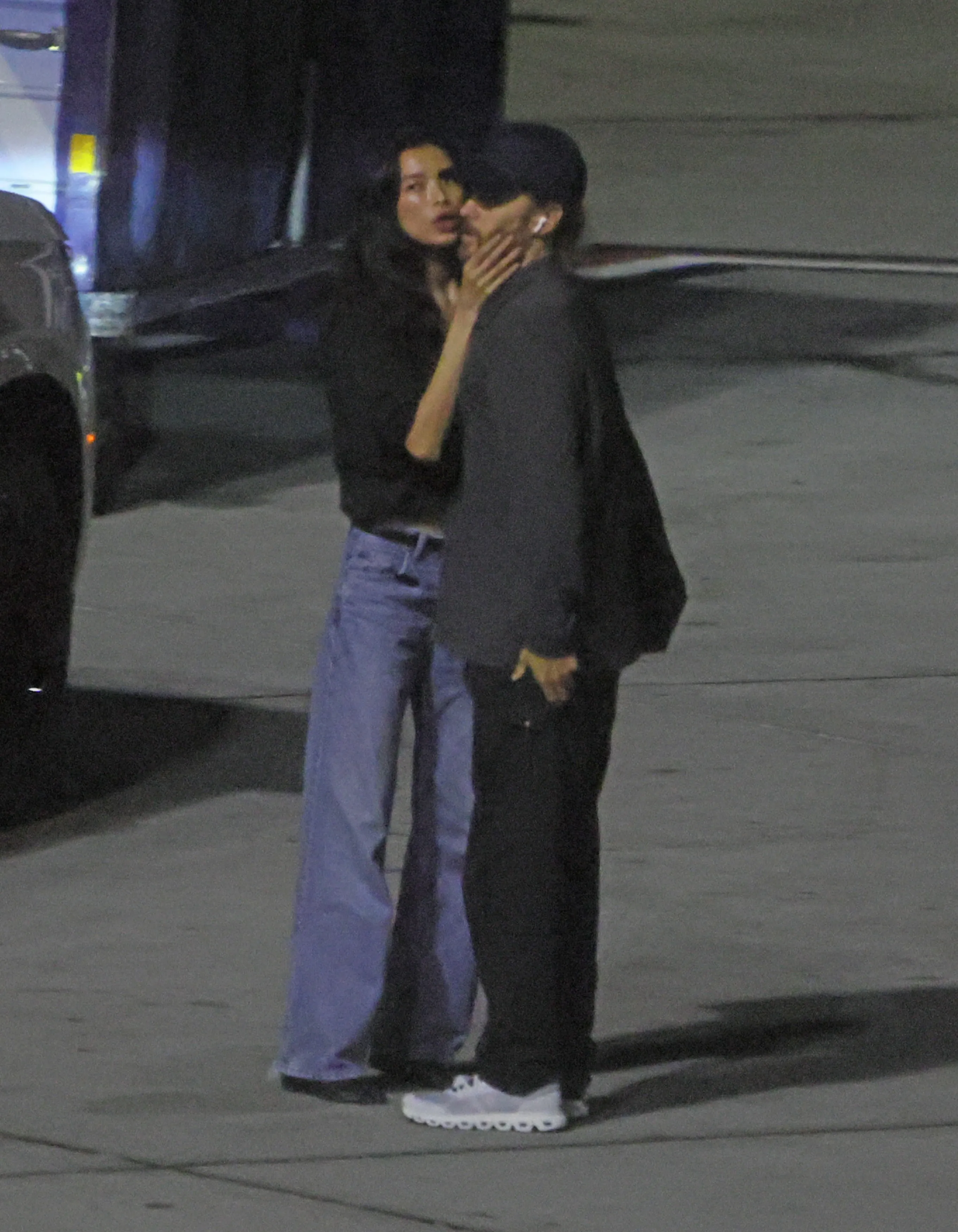 Jared Leto and Thet Thinn sharing a kiss on the tarmac at LAX.