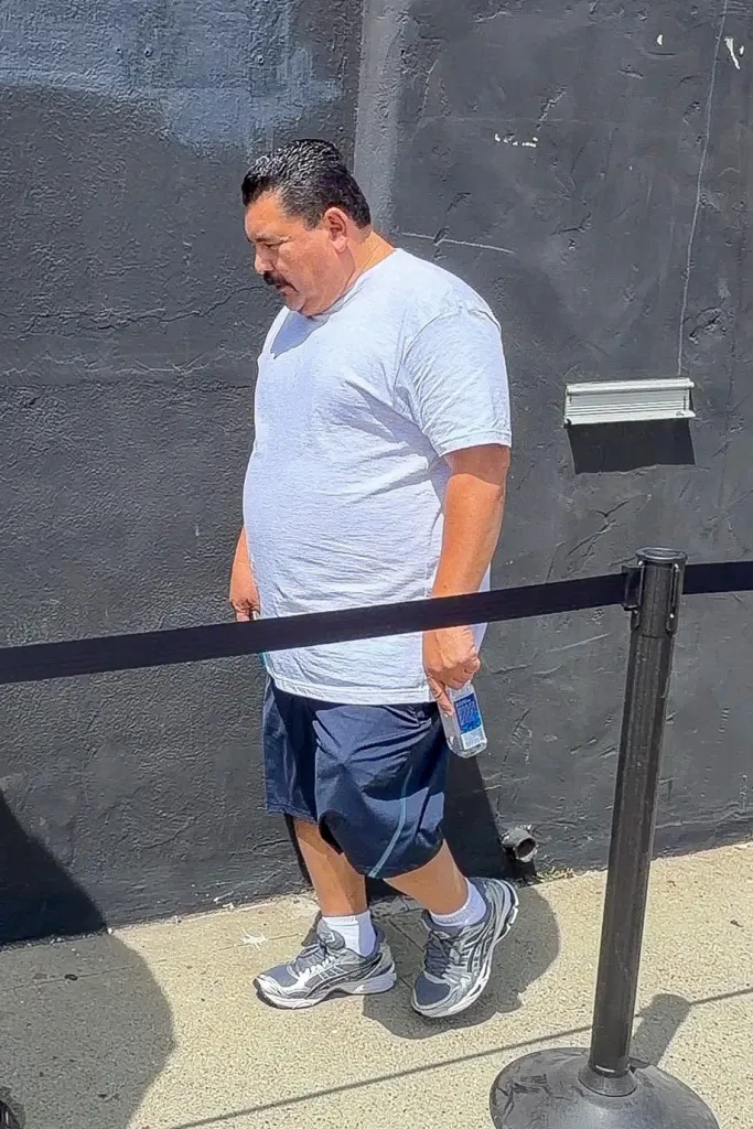 Guillermo Rodriguez in a white t-shirt and blue shorts, leaving Dancing With the Stars rehearsals.