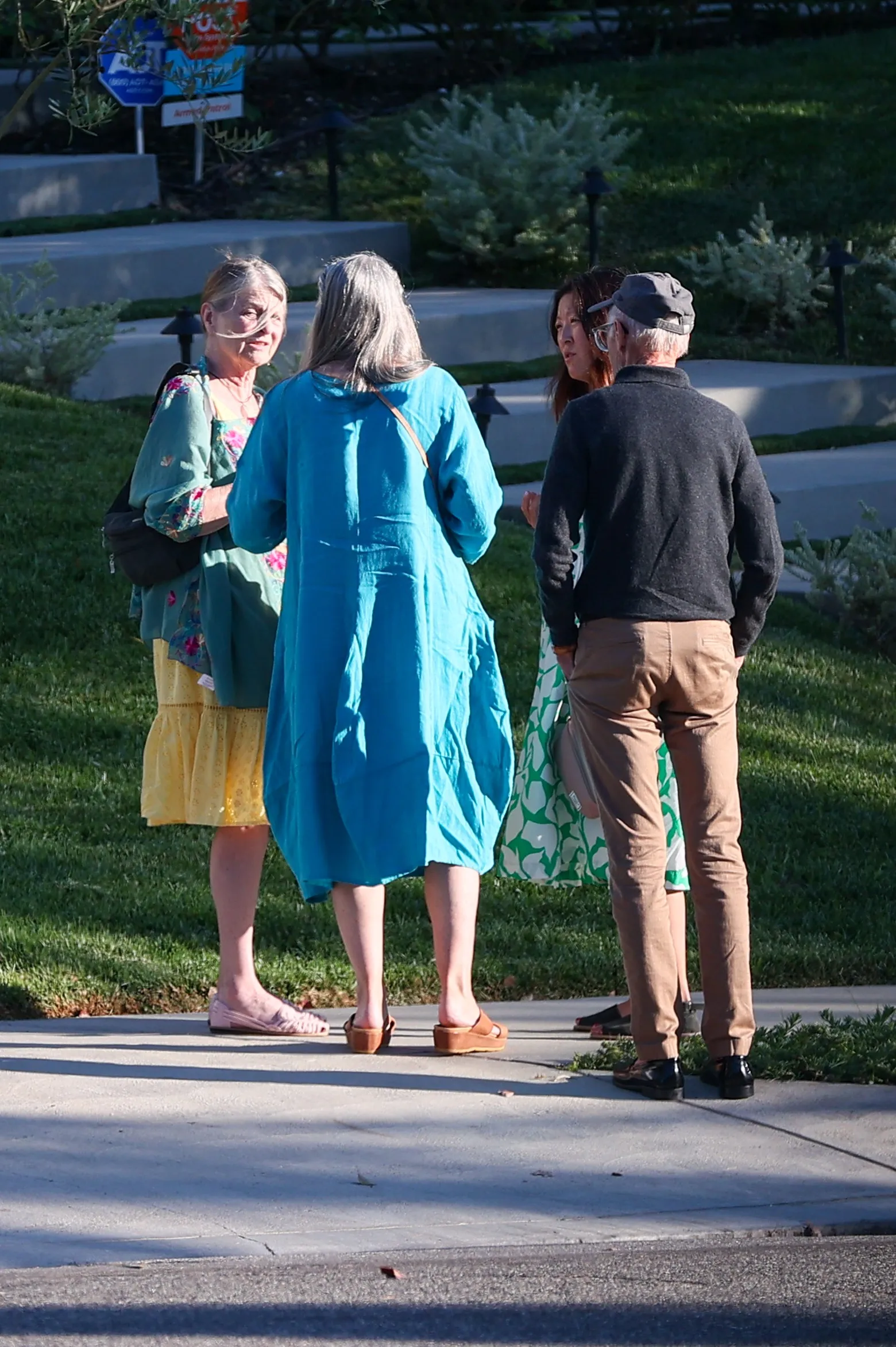 Susan St. James talking with friends and family at her home.
