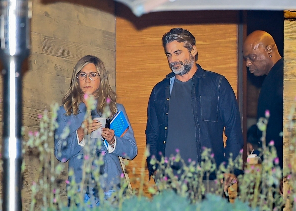 Jennifer Aniston and Jim Curtis leaving Nobu Malibu with a security guard.