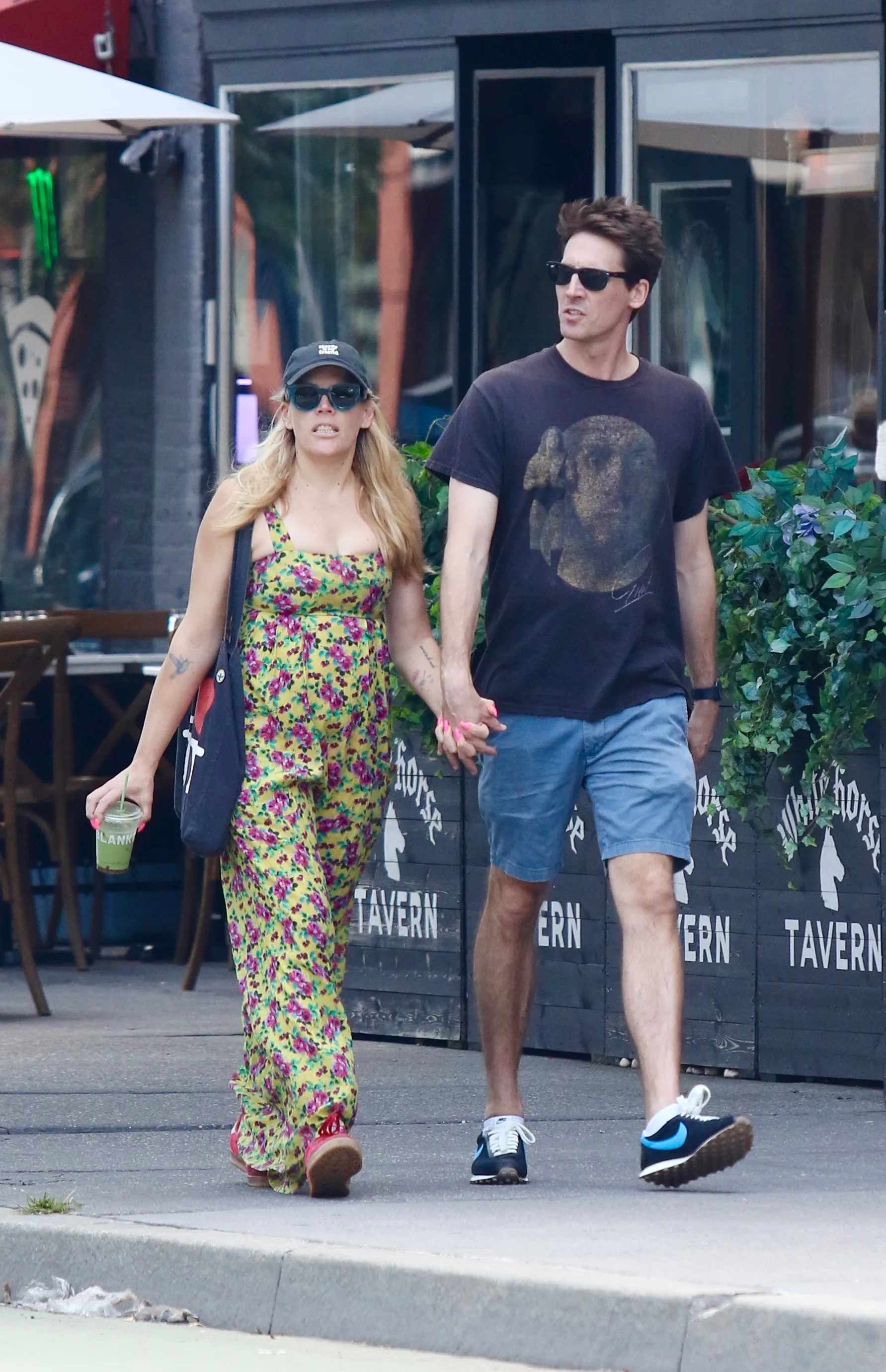 Busy Philipps and Blake Berris hold hands on a romantic stroll in Manhattan's West Village.
