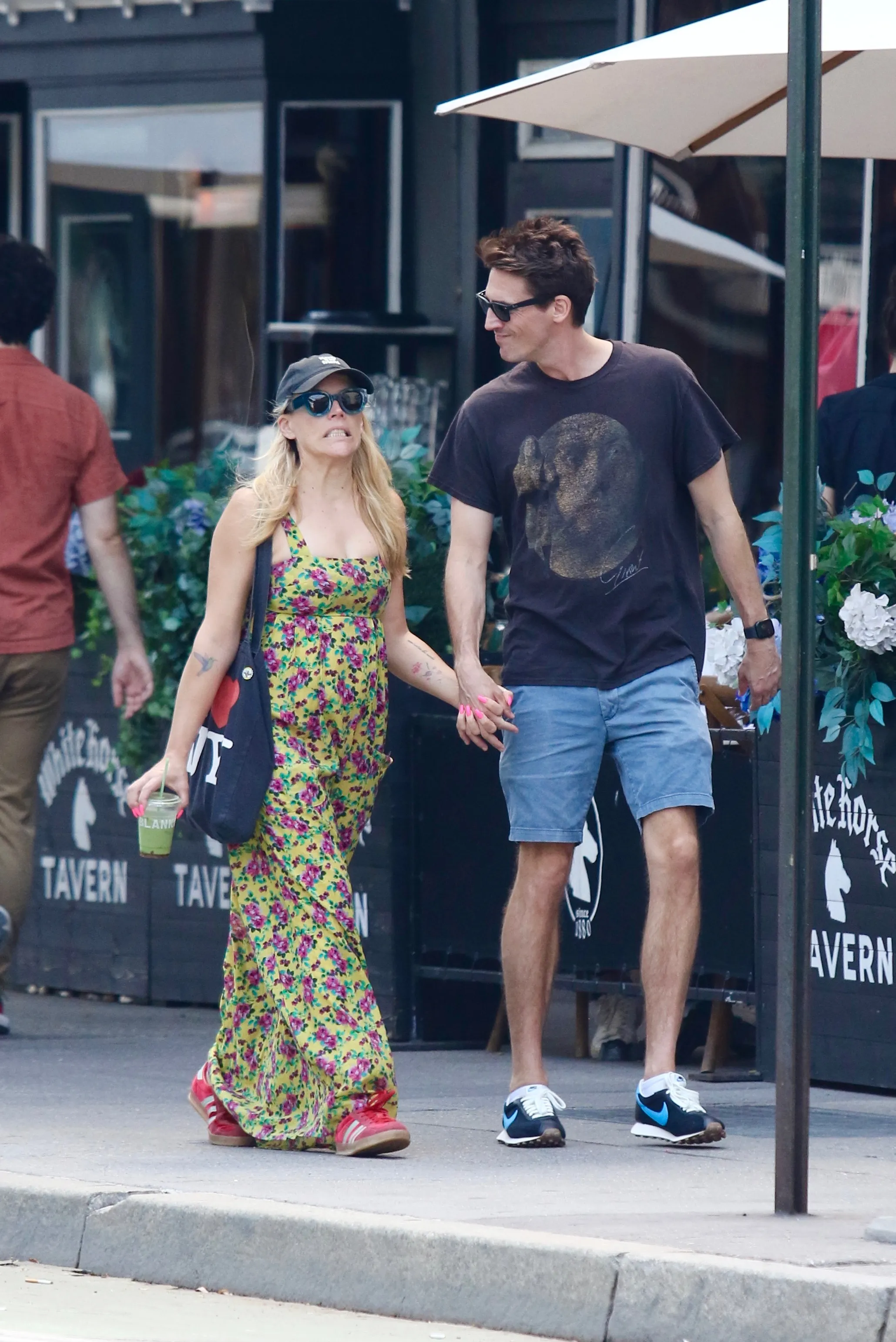 Busy Philipps and Blake Berris hold hands during a romantic stroll in Manhattan’s West Village.