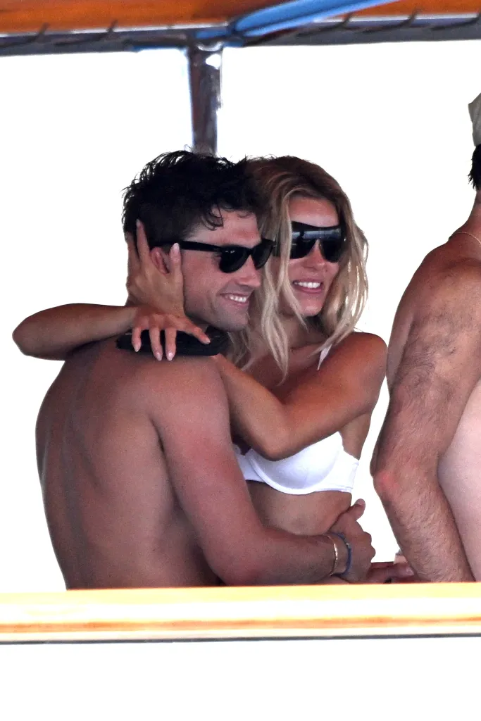 Brooks Nader embracing Jack Lumsden while on a yacht in Positano.