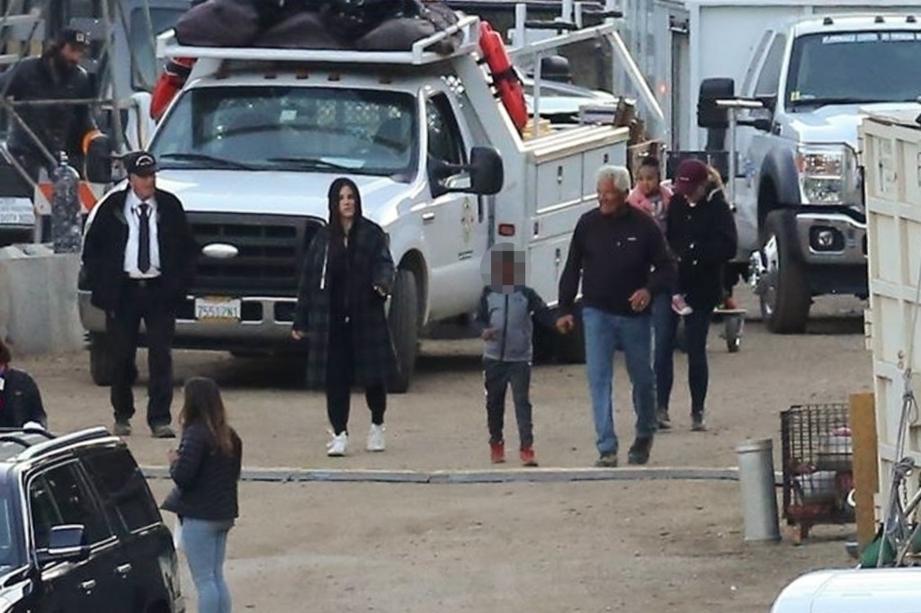 Sandra Bullock with her children Louis and Laila, and a bodyguard on the set of 'Bird Box'.