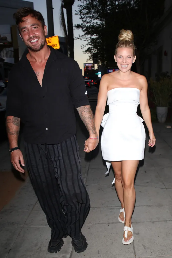 AnnaLynne McCord and Danny Cipriani holding hands at a family pre-wedding dinner.