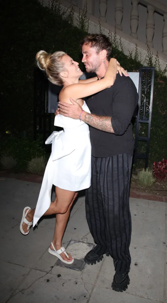 AnnaLynne McCord and Danny Cipriani embracing and smiling for a pre-wedding dinner.
