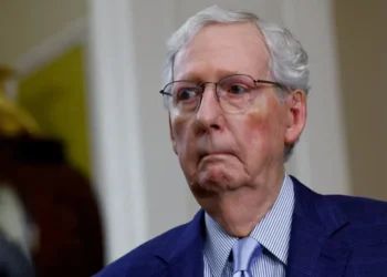 Silent and smirking McConnell aide buried on social media