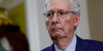 Silent and smirking McConnell aide buried on social media
