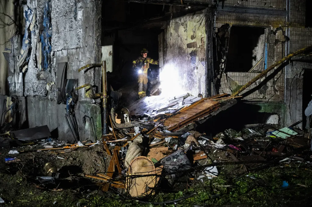 Firefighters work on a building damaged by a Russian airstrike in Kyiv, Ukraine, on Aug. 1, 2026.