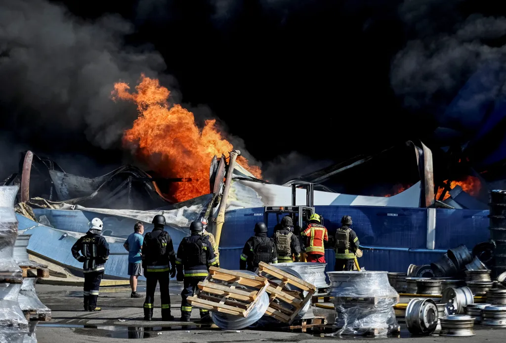 Firefighters at the site of a Russian drone strike in Kyiv.