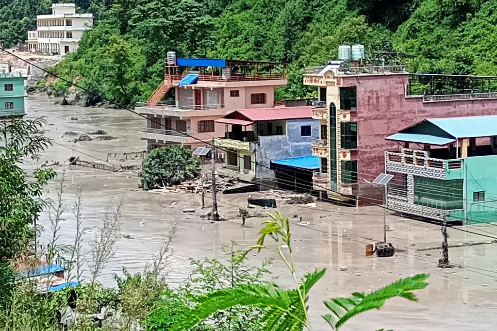 A flooded road is seen following a flash flood in Galchhi in the Dhading district, Nepal.