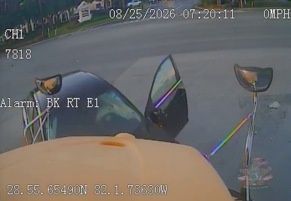 Dashcam footage from a school bus showing a car that crashed head-on into the bus.