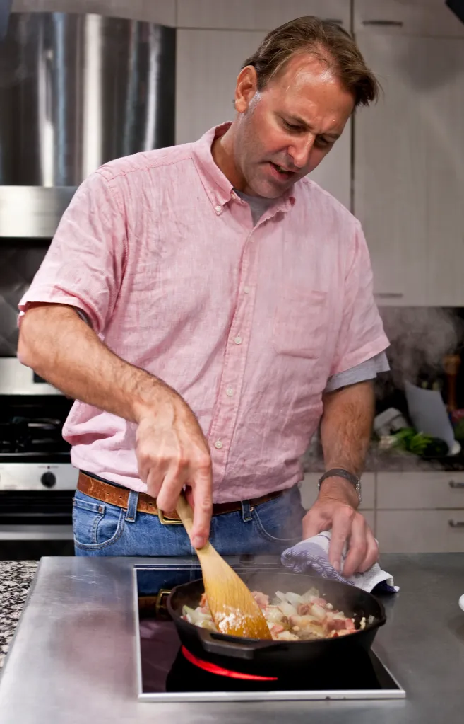 Chef Michael Ruhlman cooking in a test kitchen.