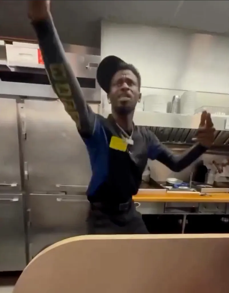 Rockstar Riley dancing in a Waffle House kitchen.