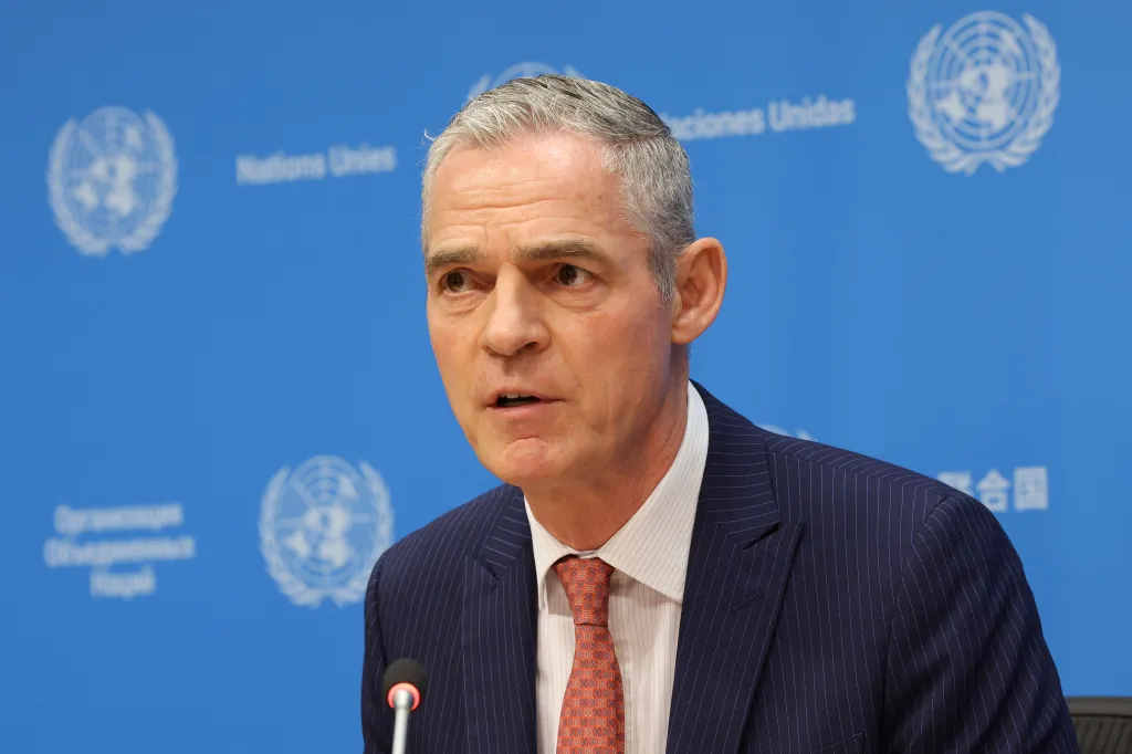 Jerome Bonnafont, France's permanent representative, speaks at a briefing in front of a blue United Nations backdrop.