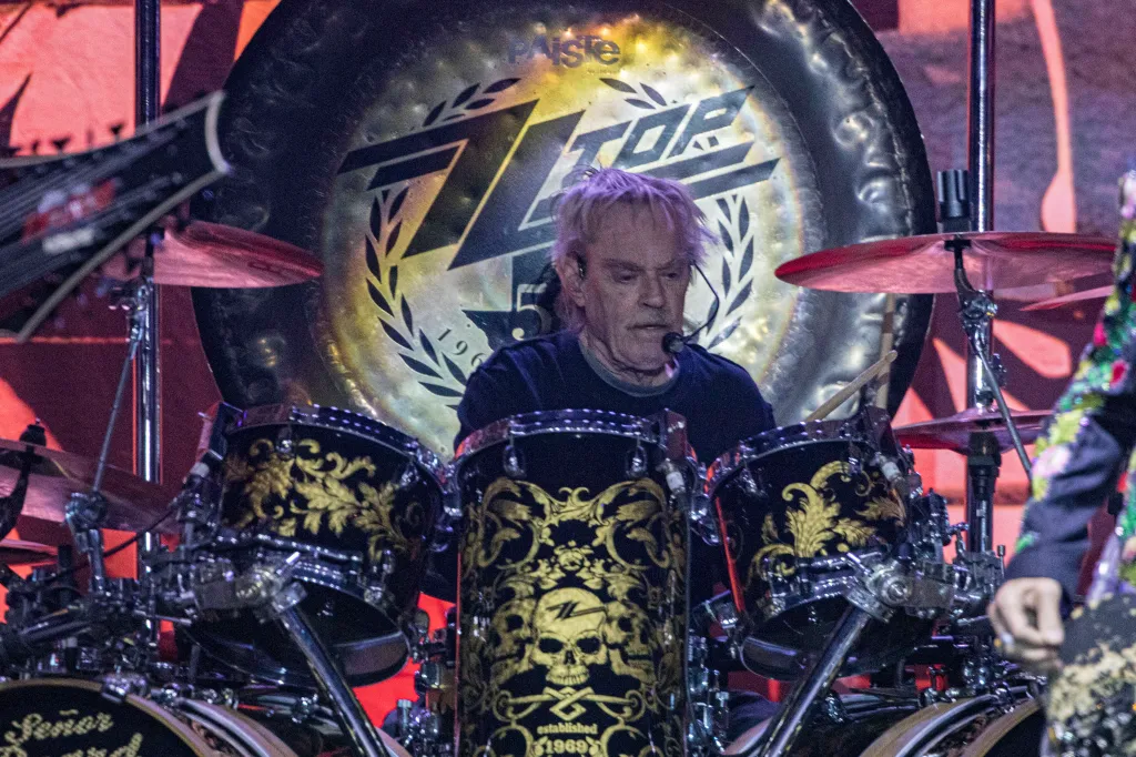 Frank Beard of ZZ Top playing drums on stage.