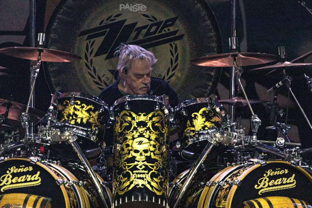 Frank Beard of ZZ Top playing drums on stage.