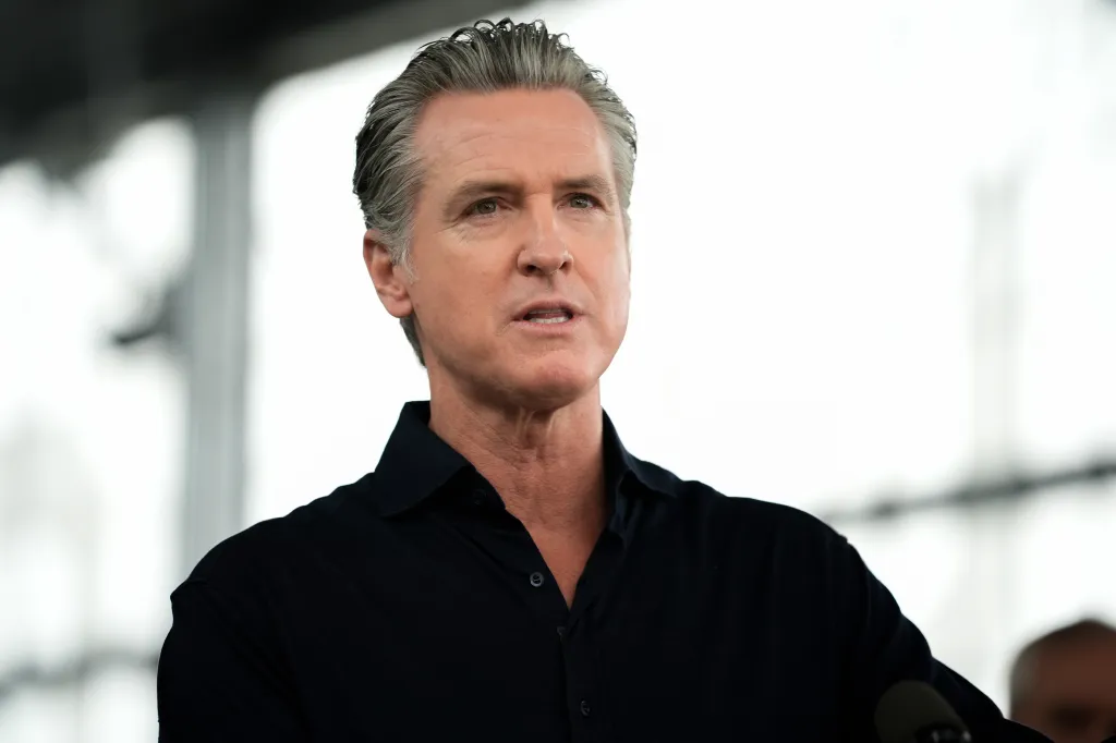 Governor Gavin Newsom speaking at a press conference in Oakland, California.