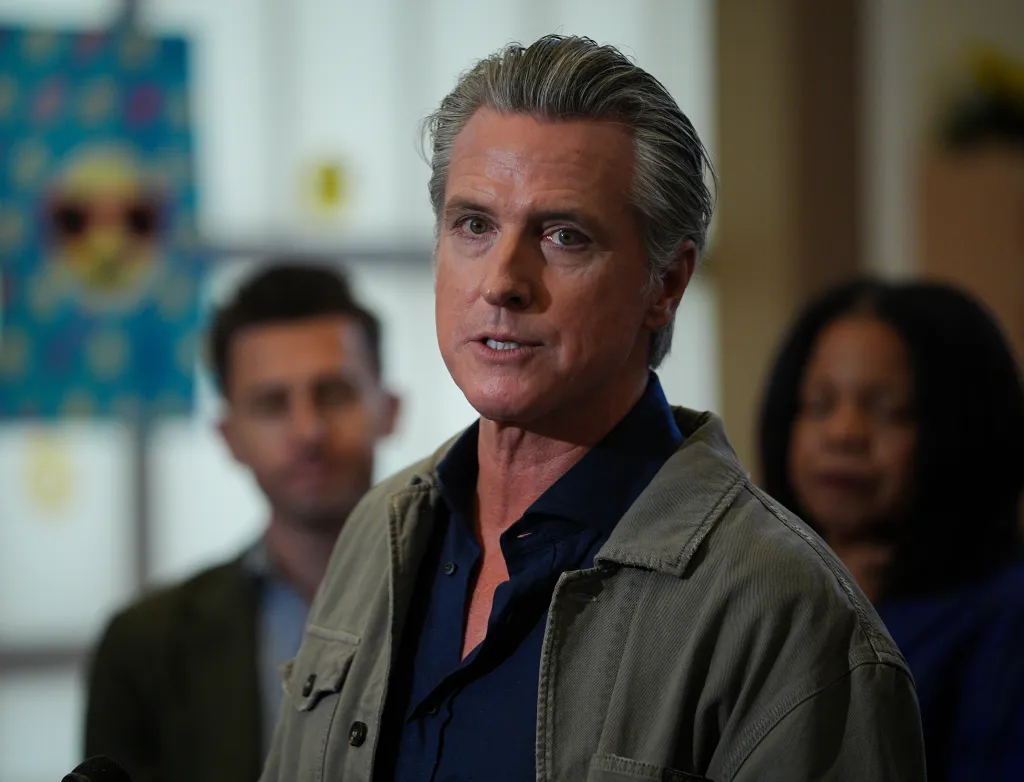 Governor Gavin Newsom speaking at a press event in Hayward, California.