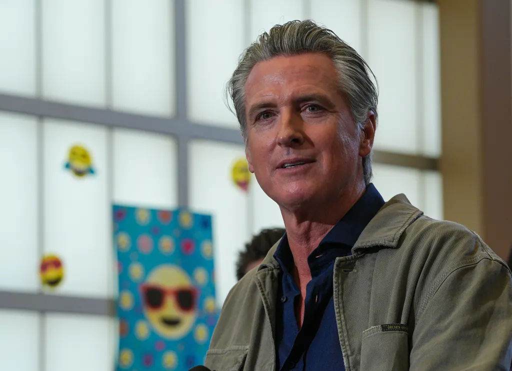 Governor Gavin Newsom speaking at a press event in Hayward, California.