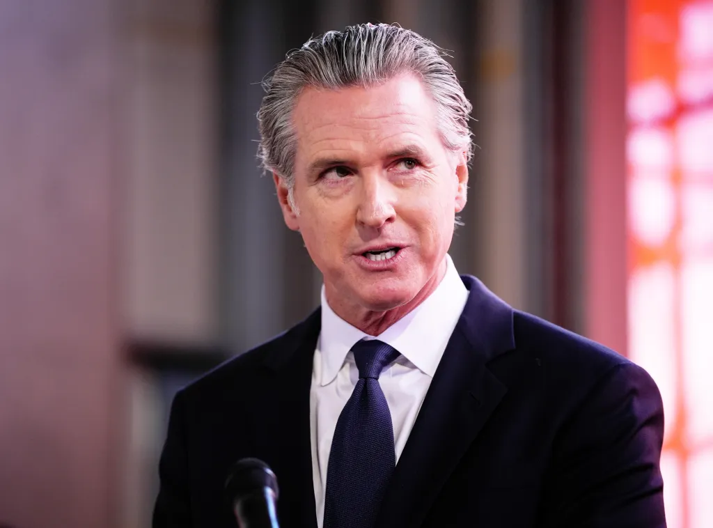 Governor Gavin Newsom speaking at a press conference.