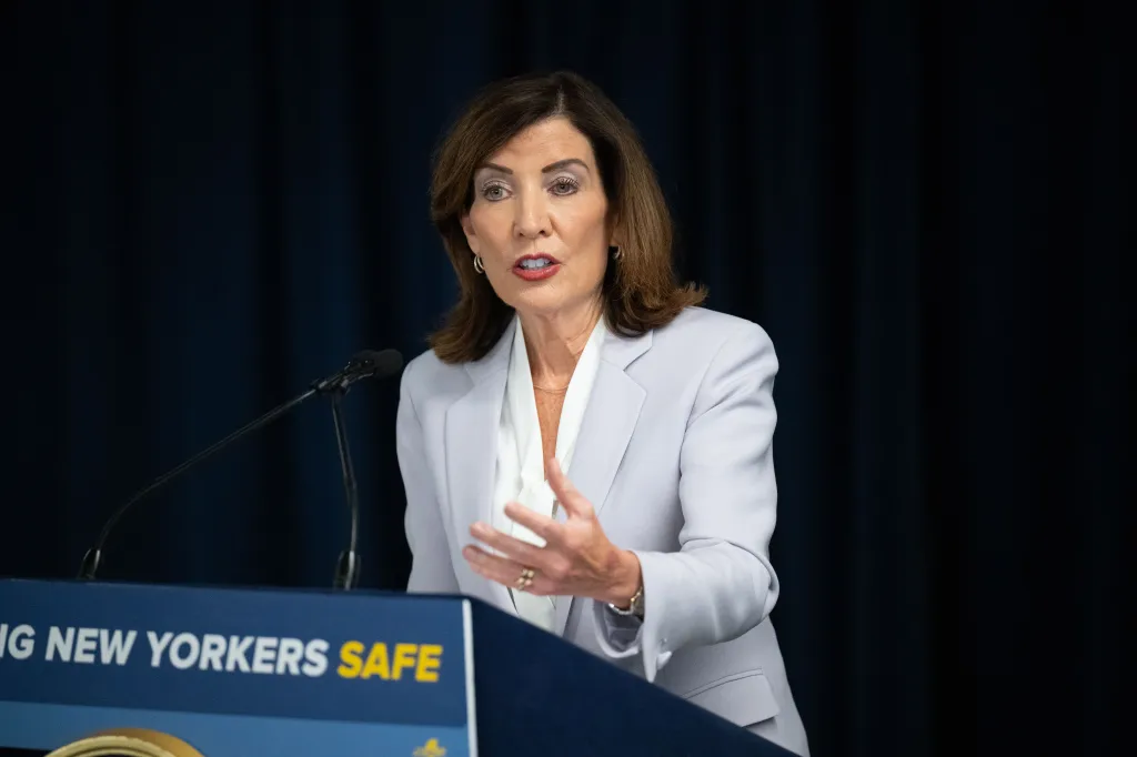 Governor Kathy Hochul speaking at a podium.