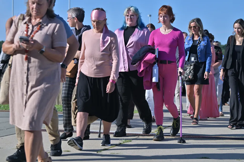 A group of Lindsay Clancy supporters walks towards Plymouth Superior Court.