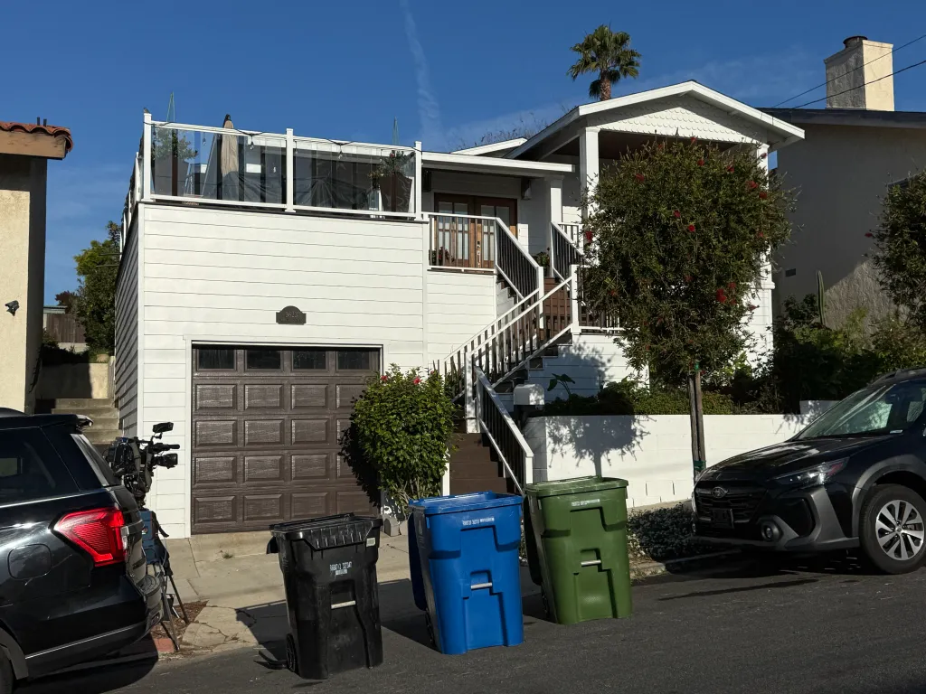 The home of LAUSD superintendent Alberto Carvalho, with news cameras parked outside.