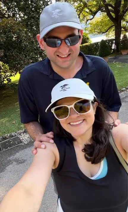 Haley Stevens and Jason Turkish smiling for a selfie outdoors.
