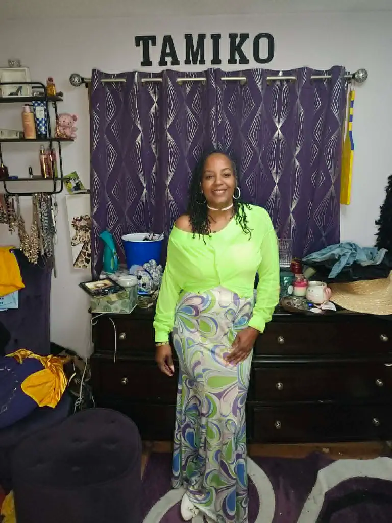 Tamiko Edwards, a former high school mean girl, poses in 2026.