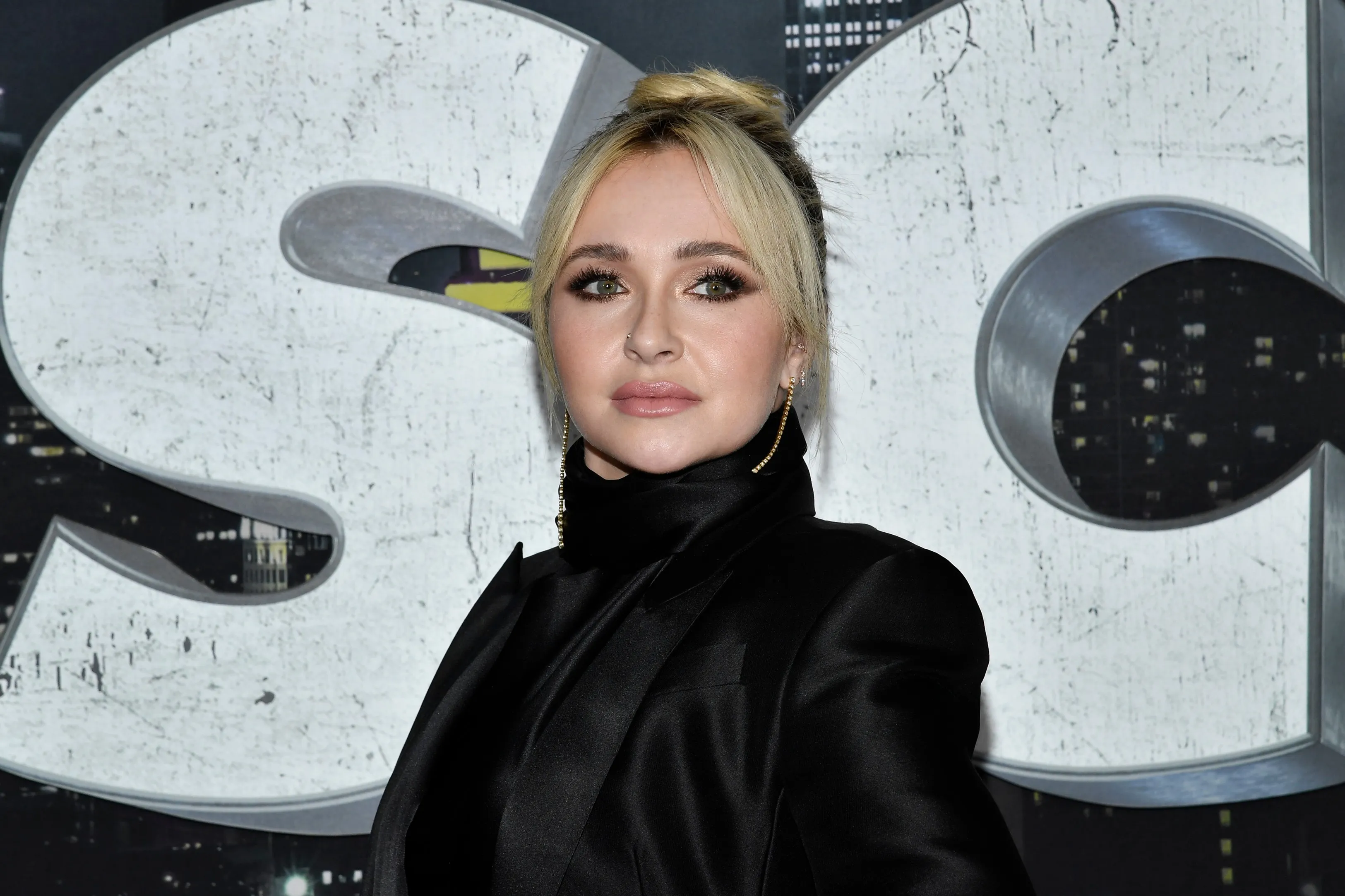 Hayden Panettiere in a black suit.