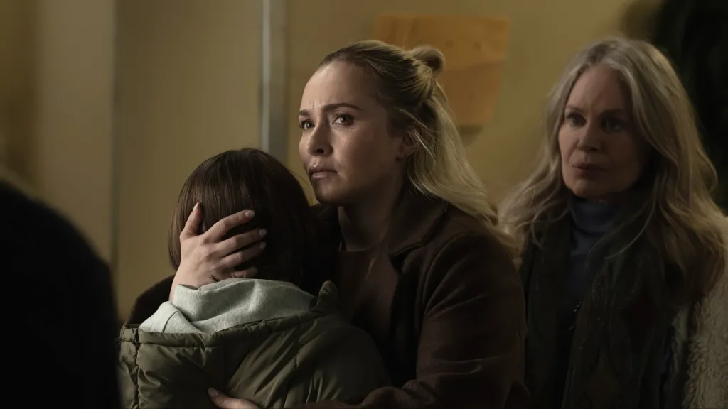 Hayden Panettiere embracing a child while Beverly D'Angelo looks on in a still from the movie SLEEPWALKER.