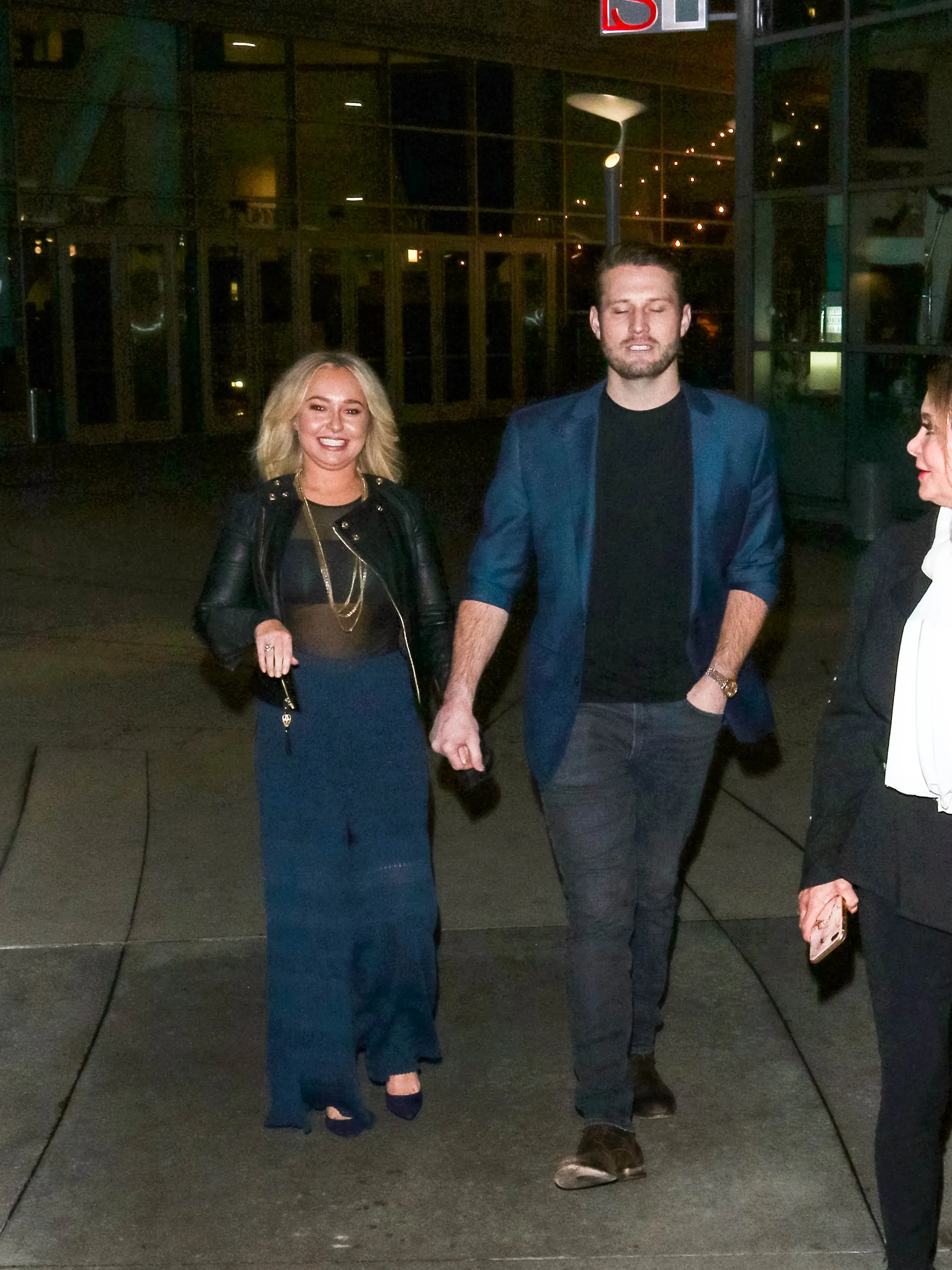 Hayden Panettiere and Brian Hickerson holding hands.