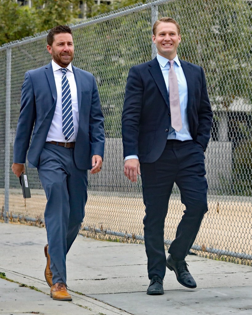 Brian Hickerson leaving court with his lawyer.