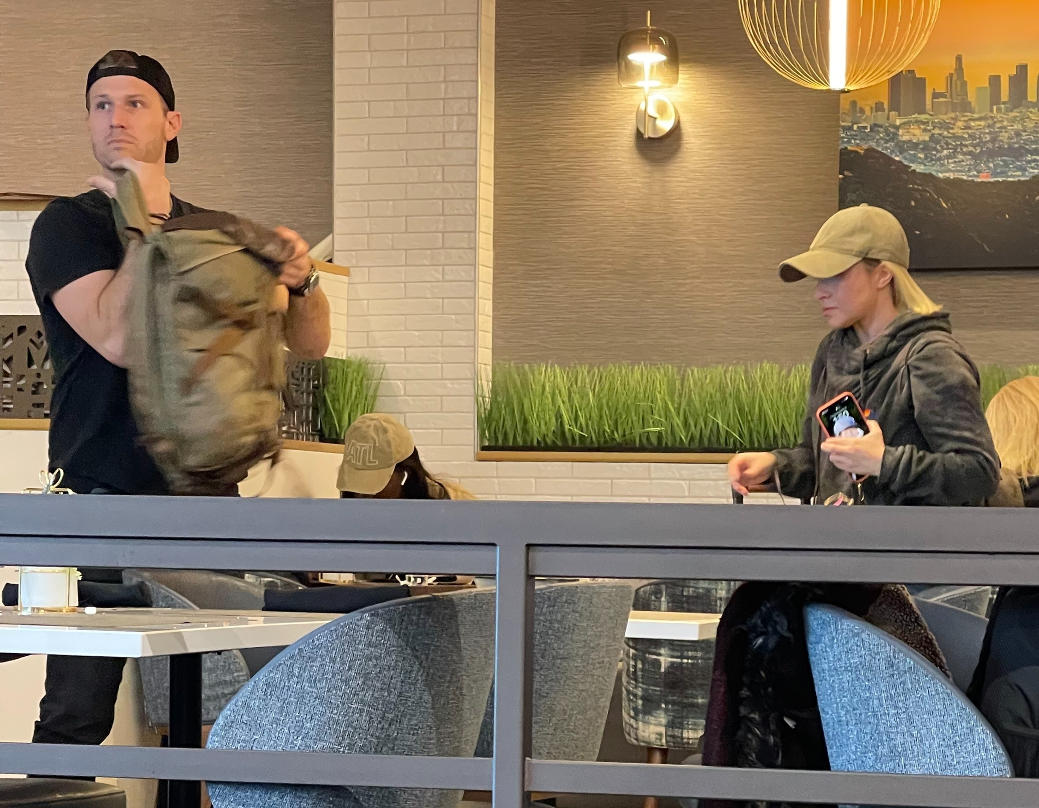 Hayden Panettiere and Brian Hickerson sitting in a restaurant.