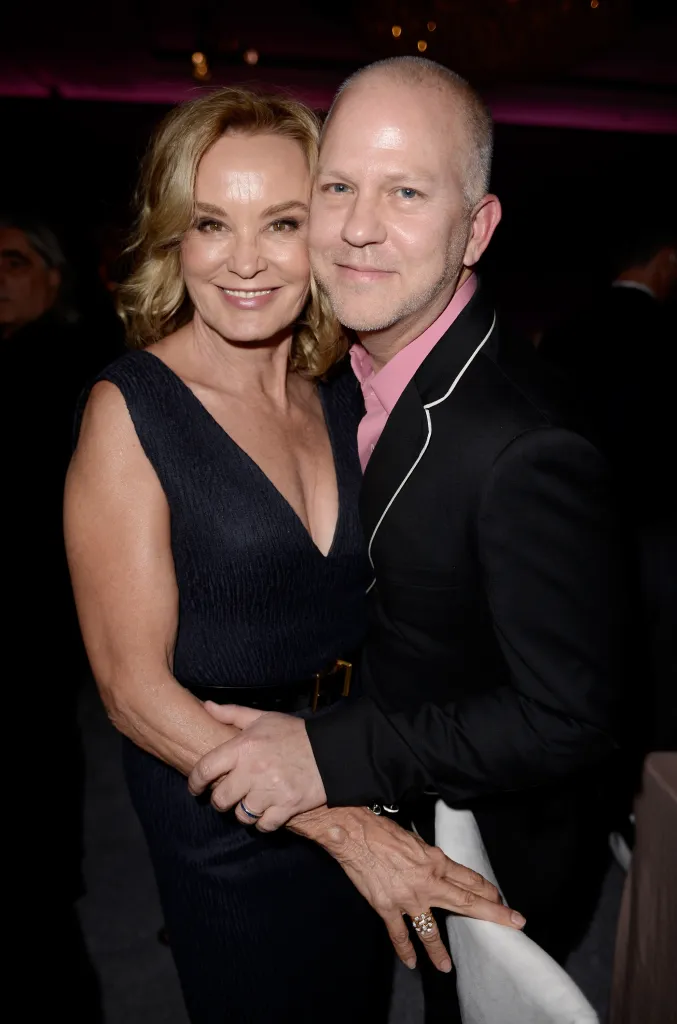 Jessica Lange and writer/director Ryan Murphy embrace.