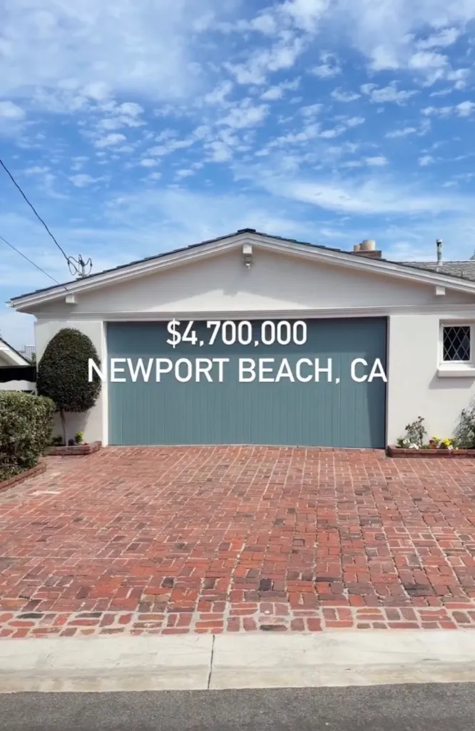 A house listing for $4,700,000 in Newport Beach, CA, with a white exterior, gray garage door, and a brick driveway.