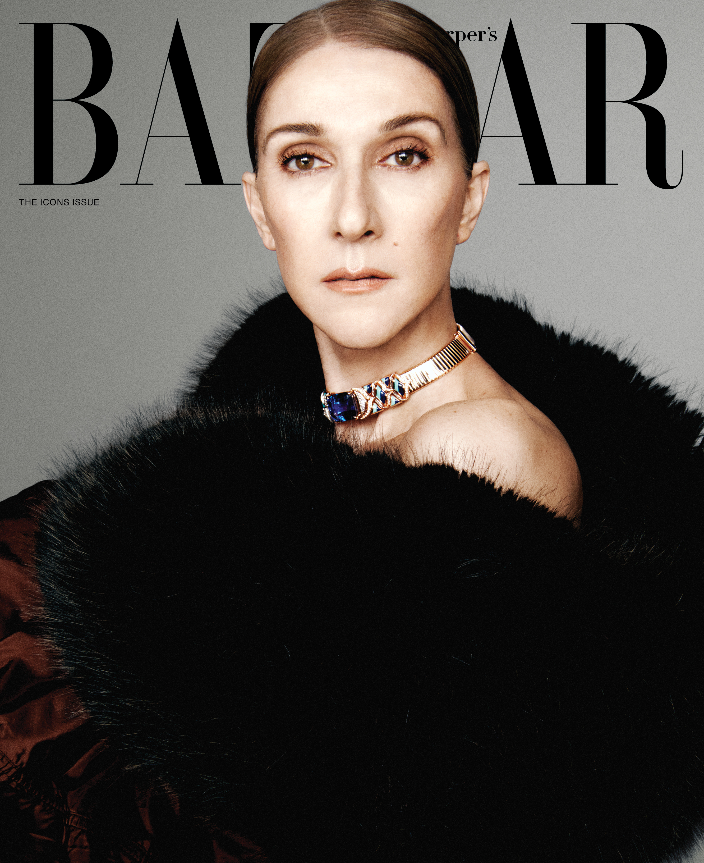 Celine Dion on the cover of Harper's BAZAAR Global 2026 ICONS Issue, wearing a dark fur stole and a gold and sapphire necklace.
