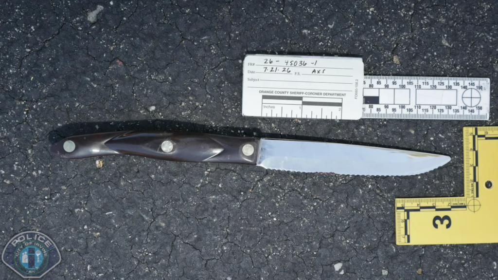 Knife found at a crime scene, next to an Orange County Sheriff-Coroner Department evidence card and a ruler.