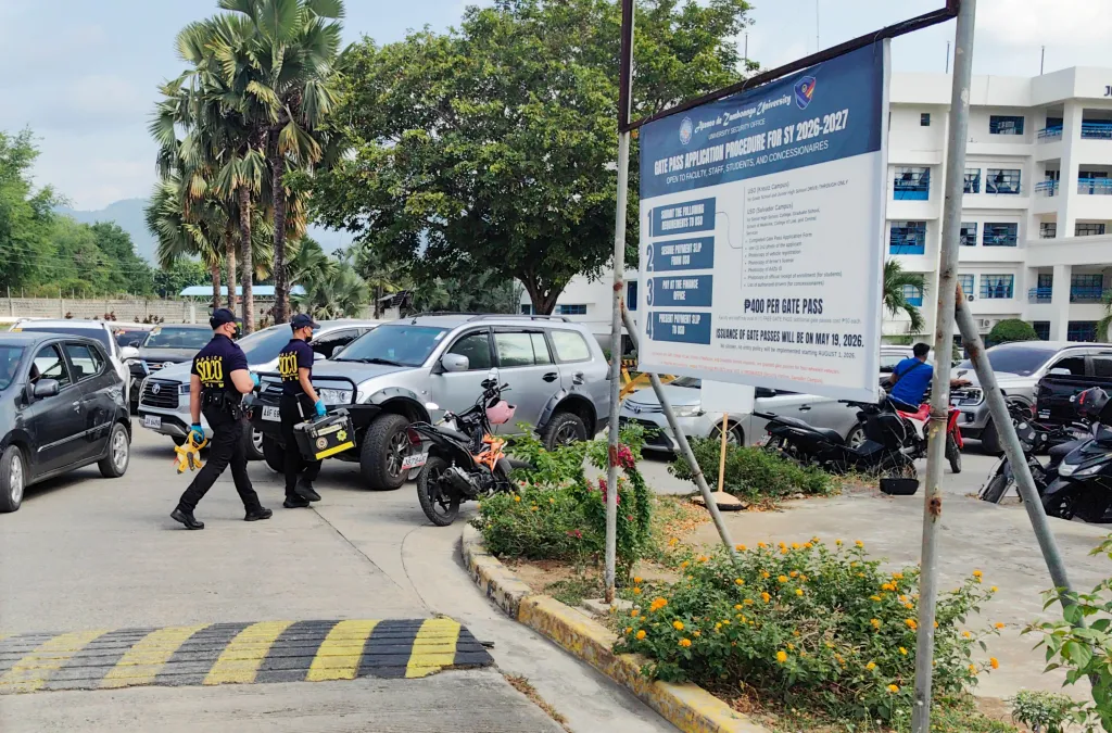 Philippine police walk through an area of the Ateneo de Zamboanga University Junior High School campus in Zamboanga City, Philippines, on Tuesday, Aug. 18, 2026.