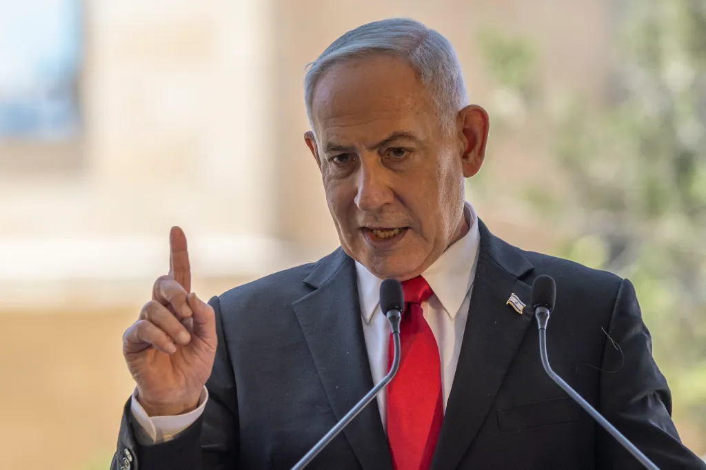 Israel's Prime Minister Benjamin Netanyahu speaks at a podium.