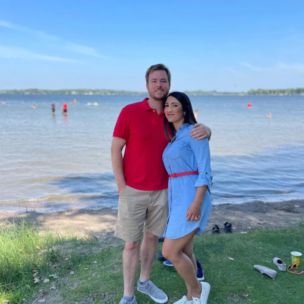 Jake Bigoni and his estranged wife, Eliana Bigoni, standing together by a lake.