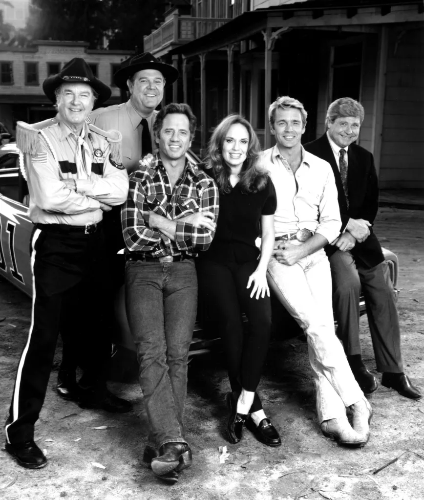 Cast of The Dukes of Hazzard on a reunion photo.