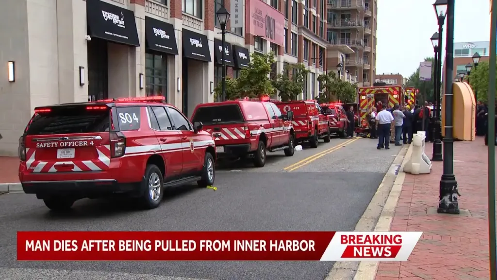 Fire and rescue vehicles lined up after receiving and emergency call of two men in the water in Baltimore's Inner Harbor.