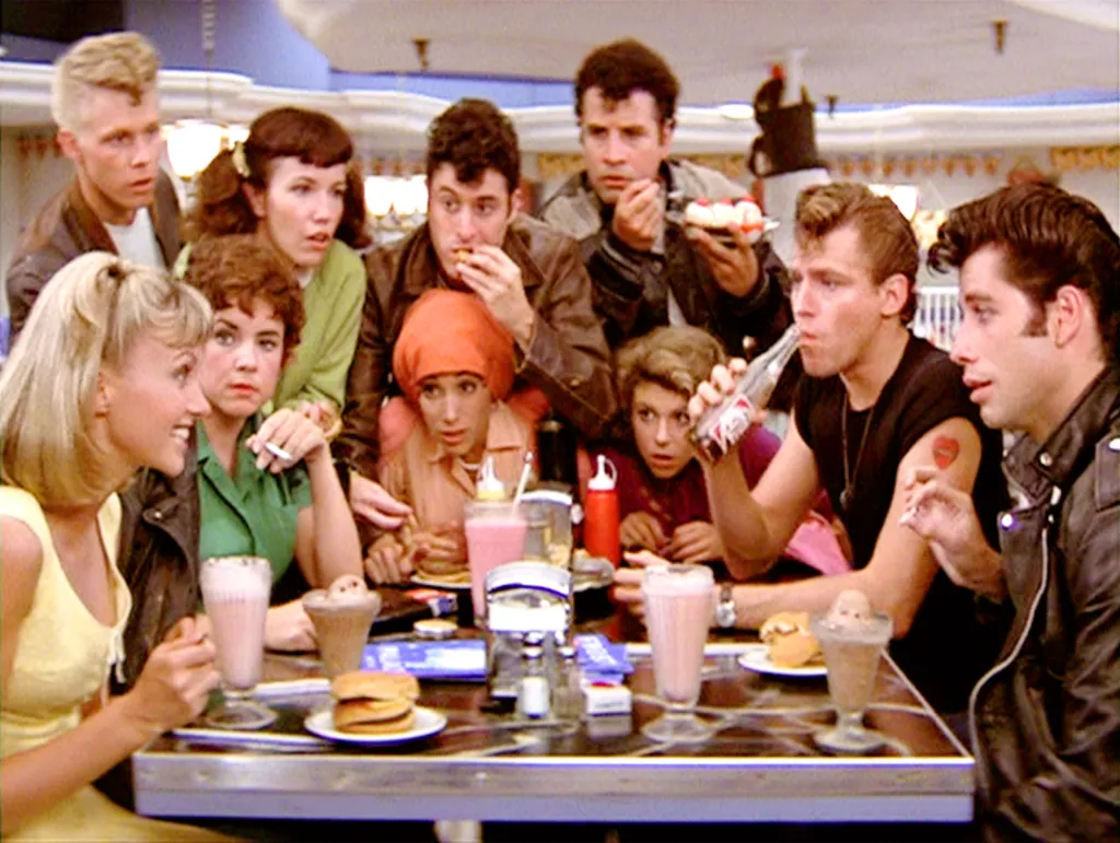 Cast members from Grease at the malt shop.