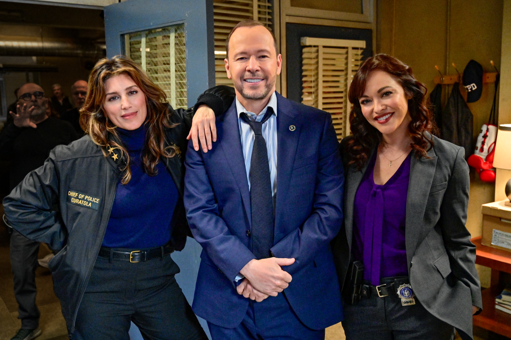 Jennifer Esposito, Donnie Wahlberg, and Marisa Ramirez smiling at the camera.